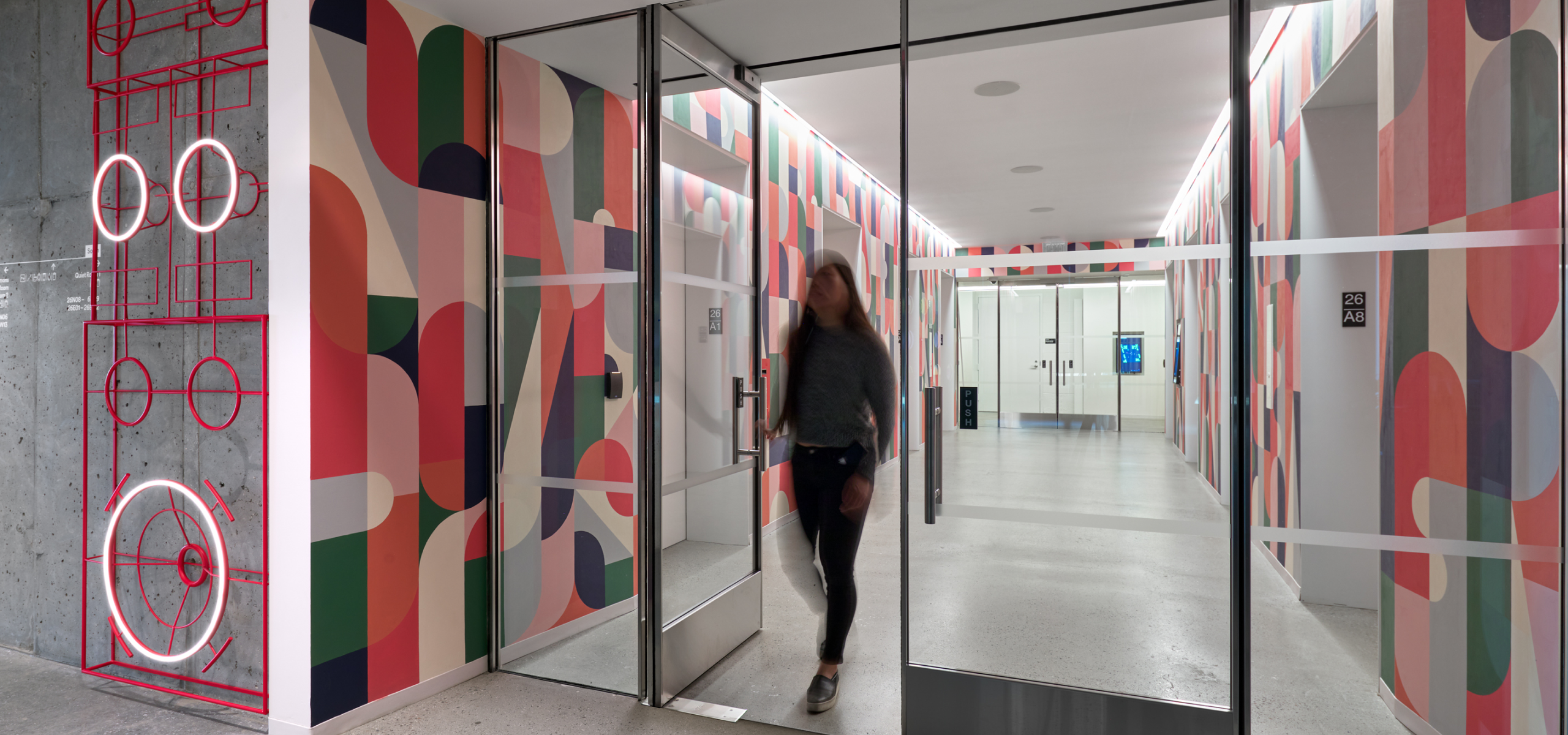 Confidential Digital Audio Streaming & Media Company mural with neon installation